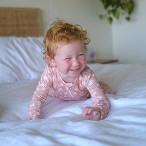 Shwally Romper for babies in a stylish design, angled view showcasing its soft fabric and playful colors.