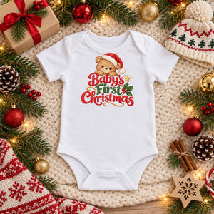 Baby's First Christmas organic cotton baby bodysuit in white, Christmas flat lay