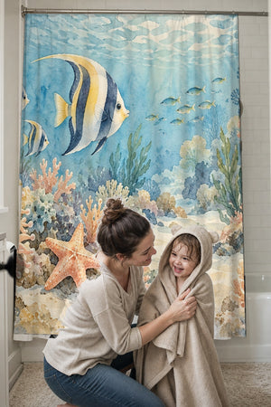 Mom drying her toddler in a hooded towel in front of the Coral Reef Ocean shower curtain