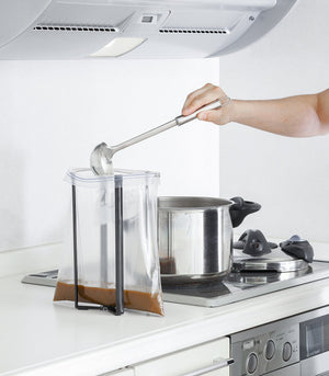 Collapsible steel bottle dryer at angle 13, perfect for efficient drying of baby bottles and accessories.