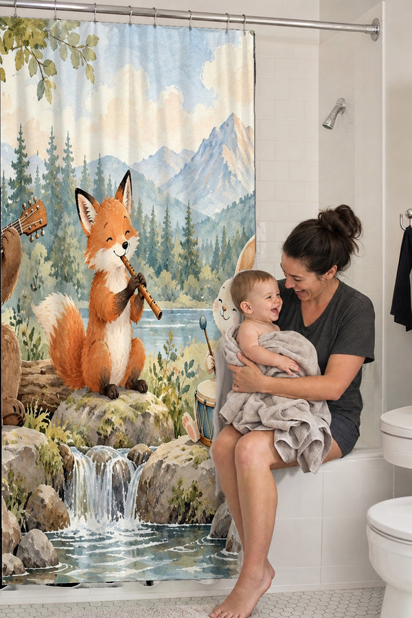 Mom holding her baby on the tub edge next to the Woodland Band shower curtain
