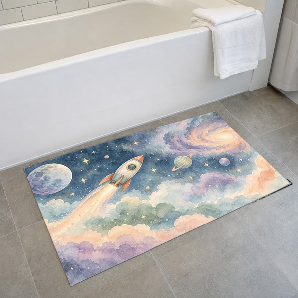 Rocket Journey bath mat on the floor in front of the tub