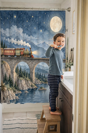 Child brushing teeth in a family bathroom with the Moonlit Train shower curtain