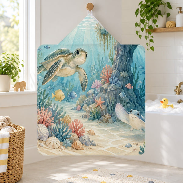 Treasure Cove Ocean kids hooded bath towel hanging in a kids bathroom
