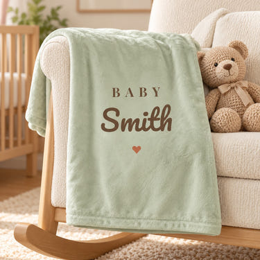 Baby Surname minky baby blanket in sage, styled photo 1