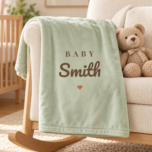 Baby Surname minky baby blanket in sage, styled photo 1
