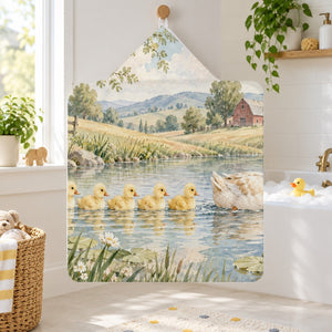 Ducklings Pond Farm kids hooded bath towel hanging in a kids bathroom