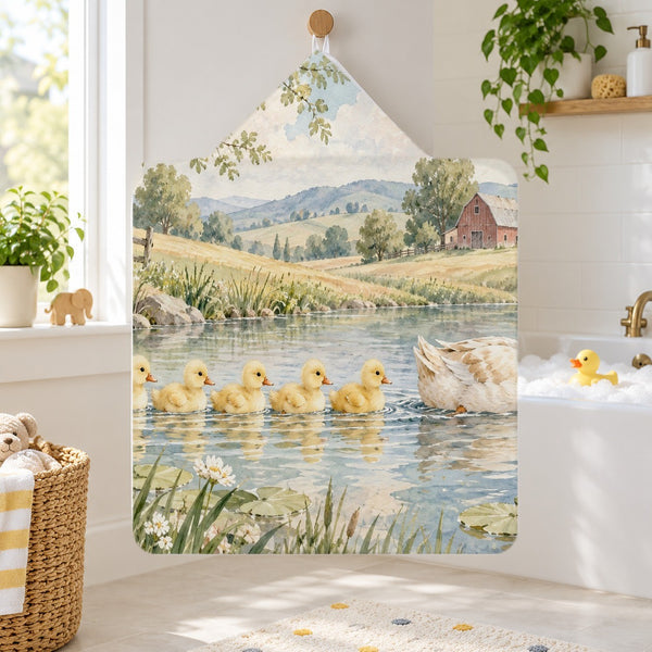 Ducklings Pond Farm kids hooded bath towel hanging in a kids bathroom