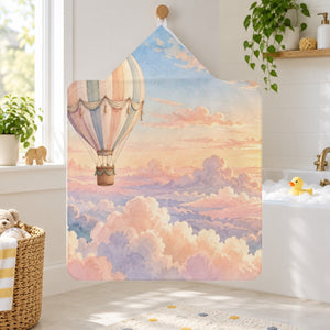 Sunrise Hot Air Balloon kids hooded bath towel hanging in a kids bathroom