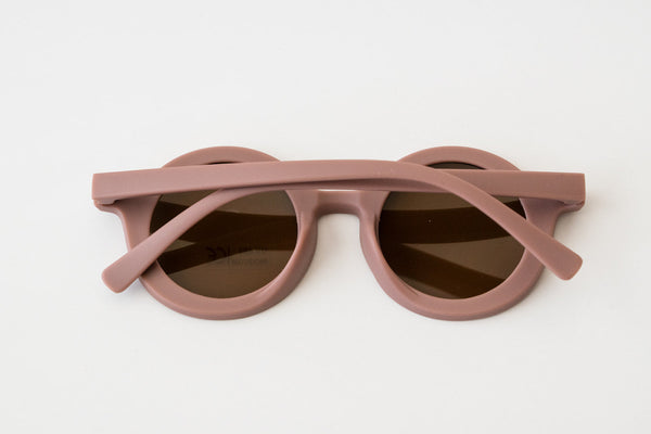 Purple retro sunglasses for toddlers and kids, stylish design, angle view showcasing frame and lens details.