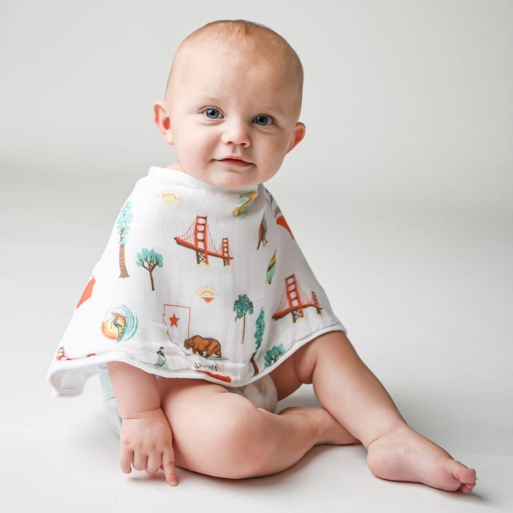 California Baby Muslin Swaddle Blanket and Burp Cloth/Bib Combo gift set for infants, perfect for swaddling and feeding.