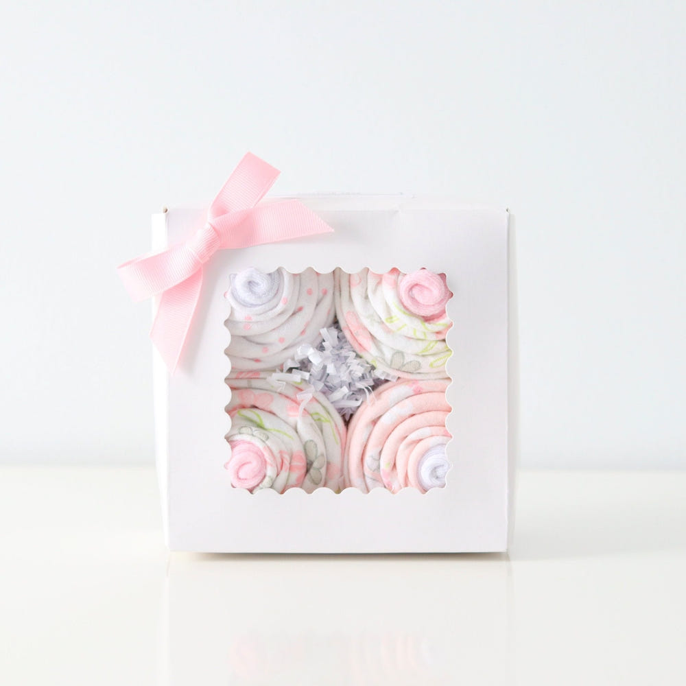 Baby girl cupcake set featuring a cute bunny design, perfect for swaddling and cozy blankets.