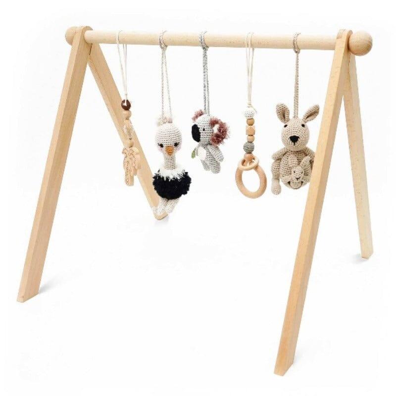 Colorful baby activity gym with crochet toys for playtime and development.