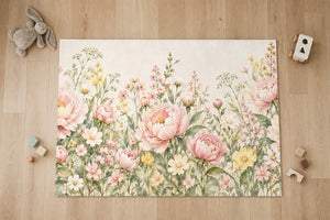 Top view of the Peony Garden kids area rug on a wood floor
