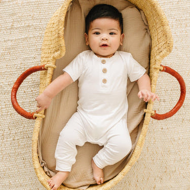 Bamboo Henley Romper for babies in soft, breathable fabric, perfect for comfort and style.