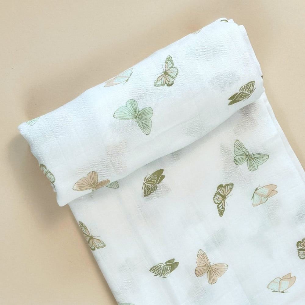 Bamboo muslin swaddle blanket with butterfly design for babies, soft and breathable for comfortable swaddling.