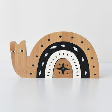 Bamboo Nesting Snail wooden toy for babies, promoting fine motor skills and imaginative play.