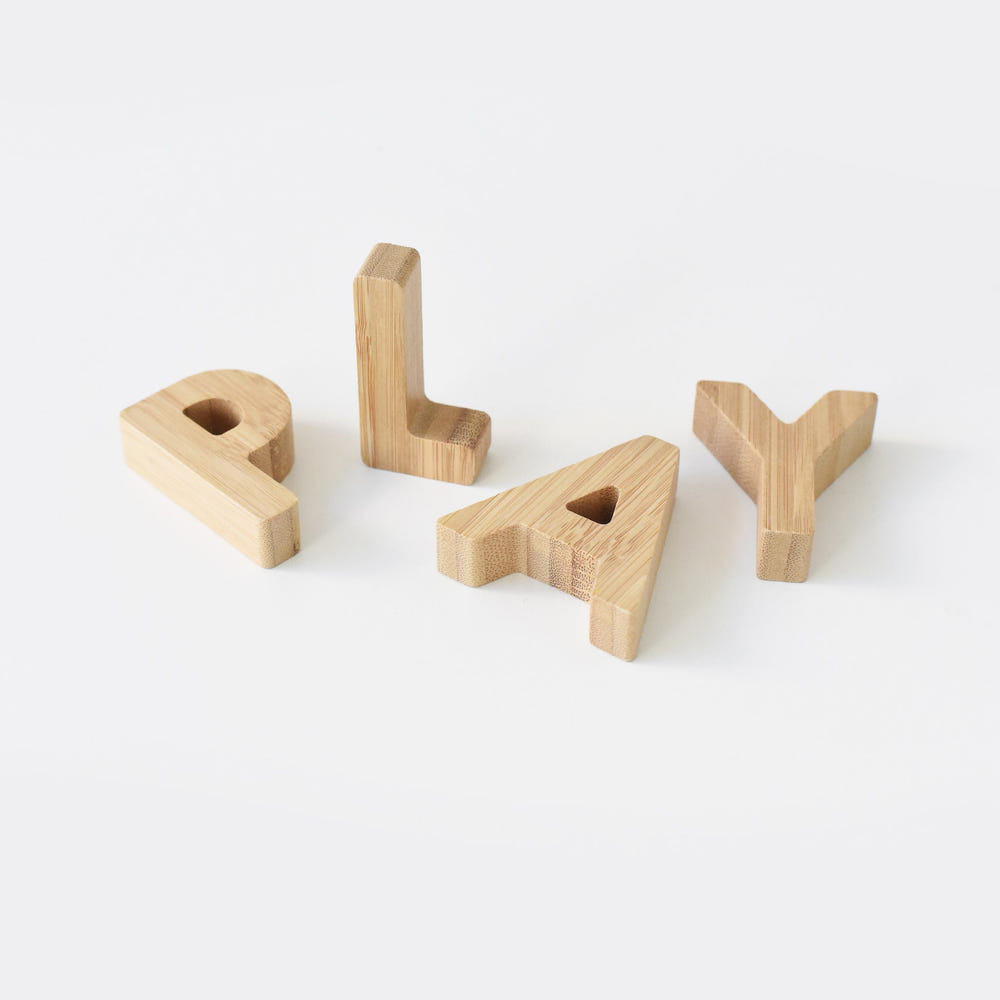Bamboo Alphabet wooden toy set for babies, promoting early learning and creativity.