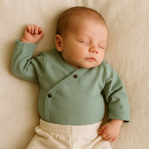 Basil Green short sleeve long bodysuit for babies, angle view showcasing soft fabric and stylish design.