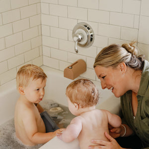 Colorful bath rinse cup for babies, perfect for gentle rinsing during bath time. Angle 24 view.