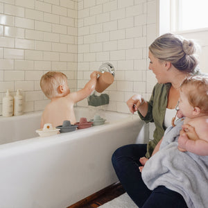 Colorful bath rinse cup for babies, designed for easy rinsing and fun bath time. Angle 13 view.