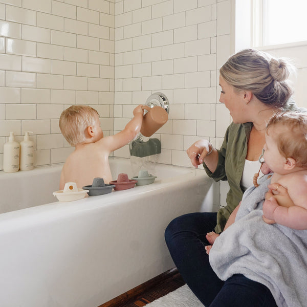 Colorful bath rinse cup for babies, designed for easy rinsing and fun bath time. Angle 13 view.