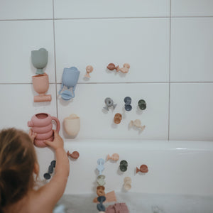 Colorful Pour and Play Bath Set for babies, featuring fun toys for engaging bath time play.