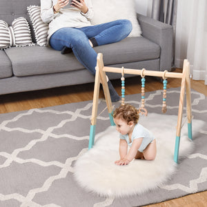 Portable wooden baby activity gym with teething toys and hanging bar for newborns. Ideal for playtime and development.