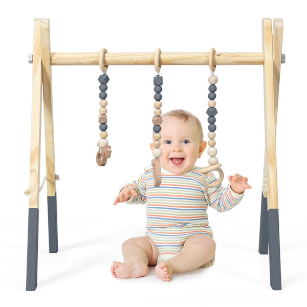 Portable wooden baby gym with teething toys, perfect for newborns, viewed from angle 24.