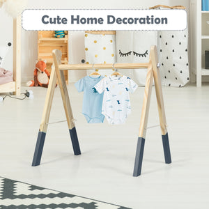 Portable wooden baby gym with teething toys, perfect for newborns, shown at angle 23.