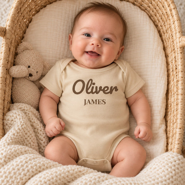 Baby wearing the First and Middle Name baby bodysuit