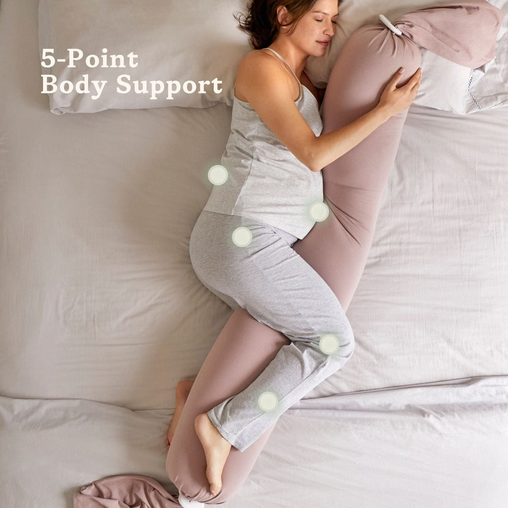 Dusty pink pregnancy pillow for nursing support, perfect for comfort during pregnancy and breastfeeding.
