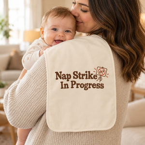 Nap Strike In Progress burp cloth in cream, styled photo 1