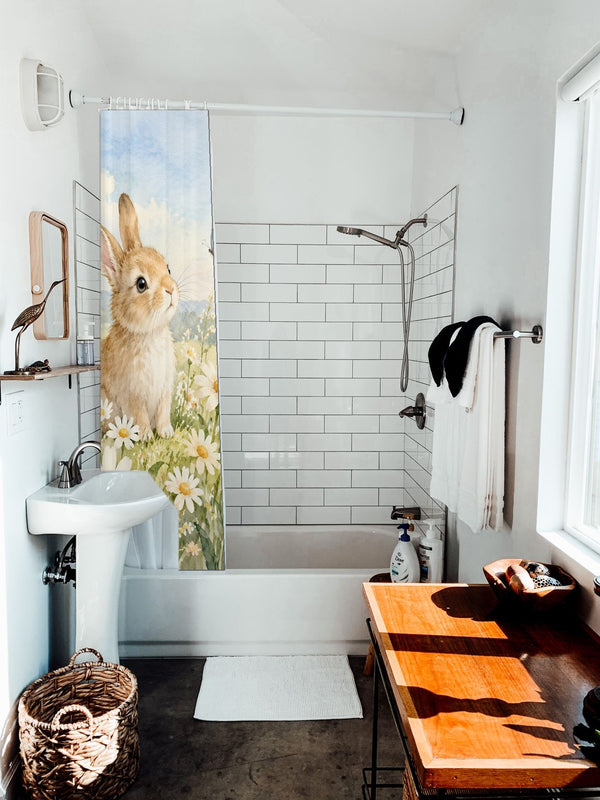 Daisy Meadow Bunny shower curtain hanging on the rod over a white bathtub