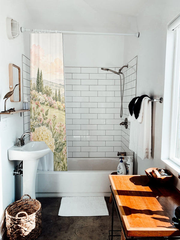 Hydrangea Garden shower curtain hanging on the rod over a white bathtub