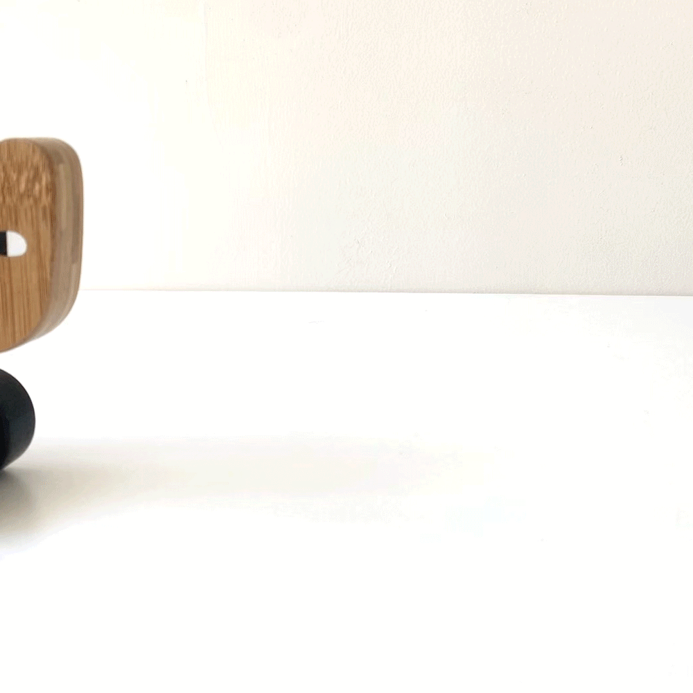 Wooden bear push toy for babies, crafted from eco-friendly bamboo, perfect for encouraging early walking and play.