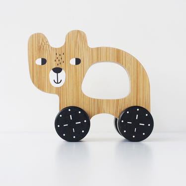 Wooden bear push toy for babies, crafted from eco-friendly bamboo, perfect for encouraging early walking and play.