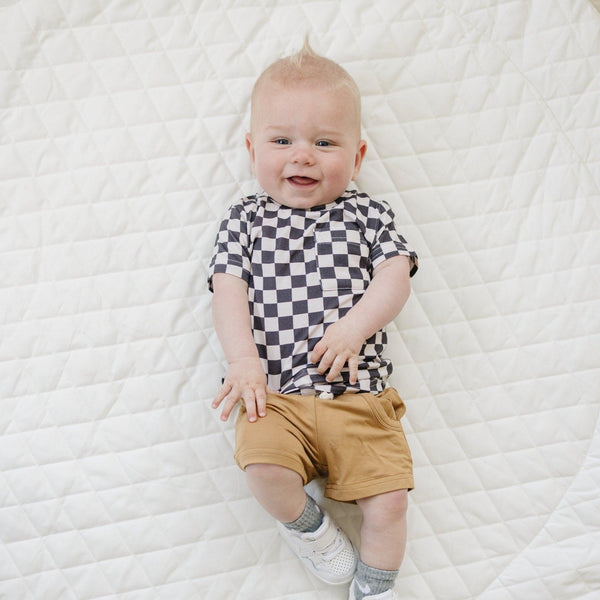 Black checkered bamboo tee for babies, stylish and comfortable top for everyday wear.