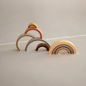 Colorful rainbow stacker toy for babies, showcasing vibrant rings at a 27-degree angle. Perfect for early development play.