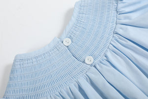 Blue and pink bow smocked romper for babies, stylish and comfortable, perfect for any occasion.