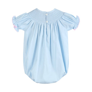 Blue and pink bow smocked romper for babies, stylish and comfortable, shown from angle 2.