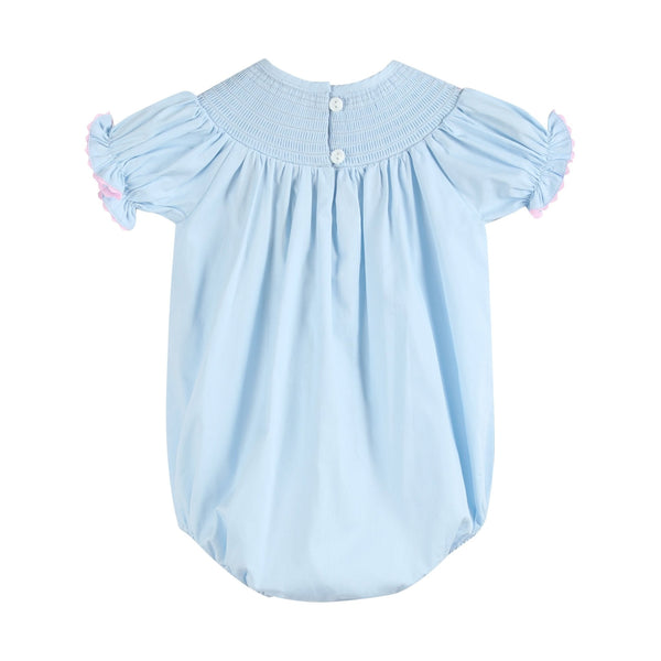 Blue and pink bow smocked romper for babies, stylish and comfortable, shown from angle 2.