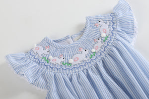 Blue Seersucker Bunny Smocked Flutter Romper for babies, angle view showcasing cute design and soft fabric.