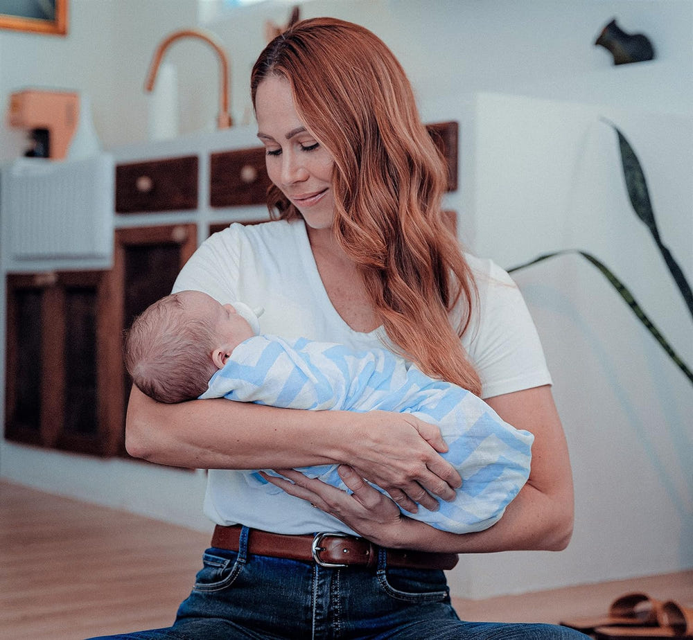 Blue muslin swaddle blankets, 4 pack, soft and breathable for comfortable baby wrapping.
