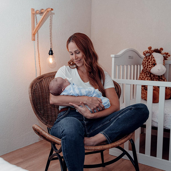 Blue muslin swaddle blankets, 4 pack, displayed at an angle for baby comfort and style.