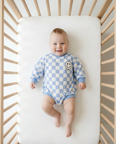 Checkered Smiley Blue Bubble Romper for babies - cute and comfortable outfit for playful moments.