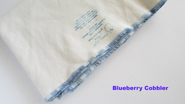 Stretchy flat cloth diapers in various colors, angled view showcasing softness and flexibility for comfortable baby wear.