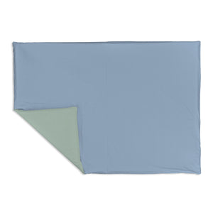 Sage + Breeze Organic Cotton Mat for babies, featuring a soft, eco-friendly design in a playful angle view.