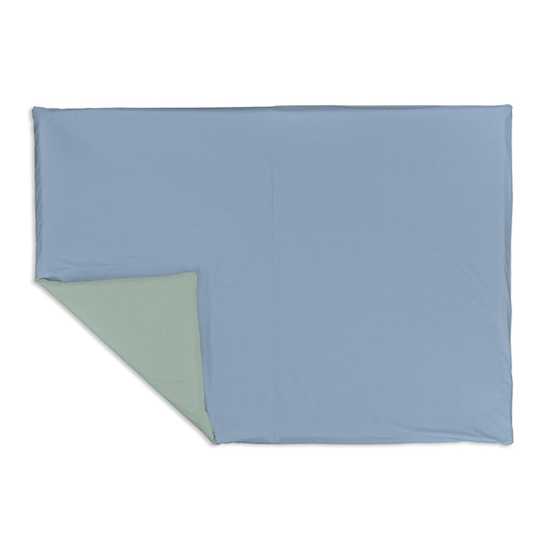 Sage + Breeze Organic Cotton Mat for babies, featuring a soft, eco-friendly design in a playful angle view.