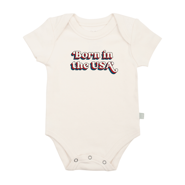 Graphic short sleeve bodysuit for babies, featuring "Born in the USA" design. Perfect for stylish little ones.